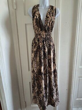 Sleeveless maxi dress featuring a beige and black animal snake print